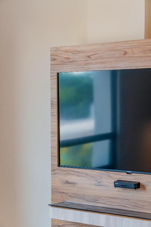 TV a/nebo společenská místnost v ubytování Hotel Central Merida by Kavia