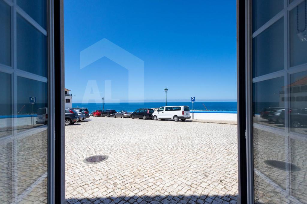 una vista desde una ventana de un estacionamiento en Ribas Apartment by ACasaDasCasas, en Ericeira