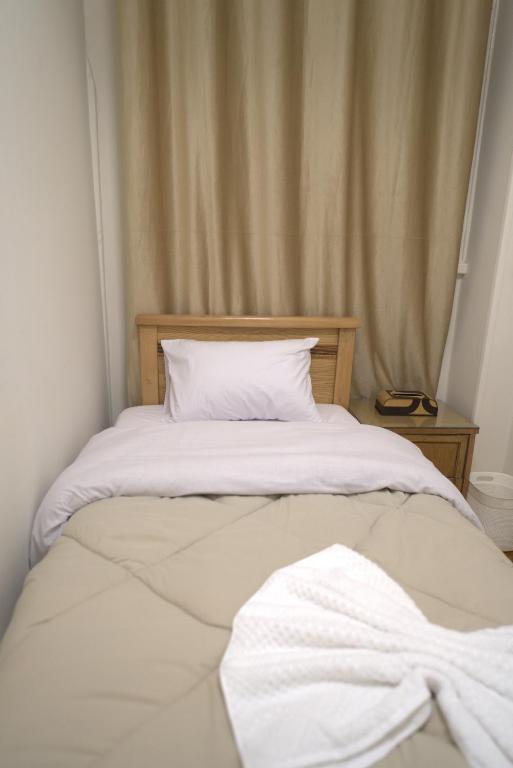 Postel nebo postele na pokoji v ubytování Central Cairo Hotel