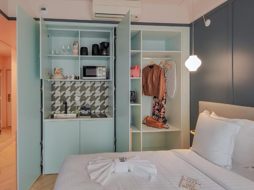 a bedroom with a bed with a bow tie on it at Aparthotel AMMI Nice Lafayette in Nice