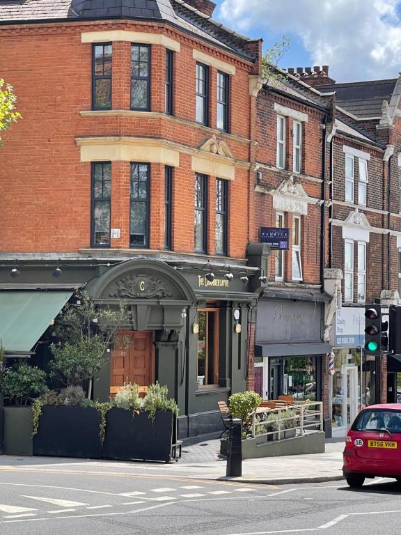 a building on the corner of a city street at Chamberlayne Inn in London