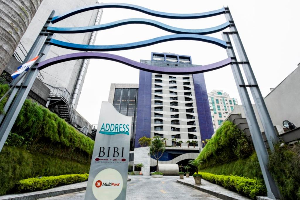 a sign in front of a building with a building at Address São Paulo Faria Lima by Intercity in Sao Paulo