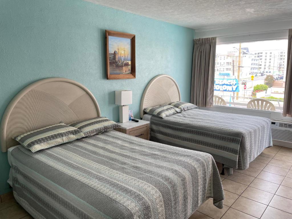 Postel nebo postele na pokoji v ubytování Beach Colony Motel