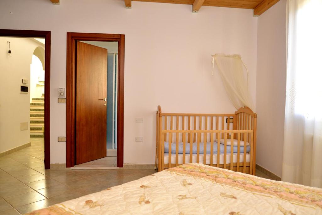 Postel nebo postele na pokoji v ubytování B&B S'Incontru