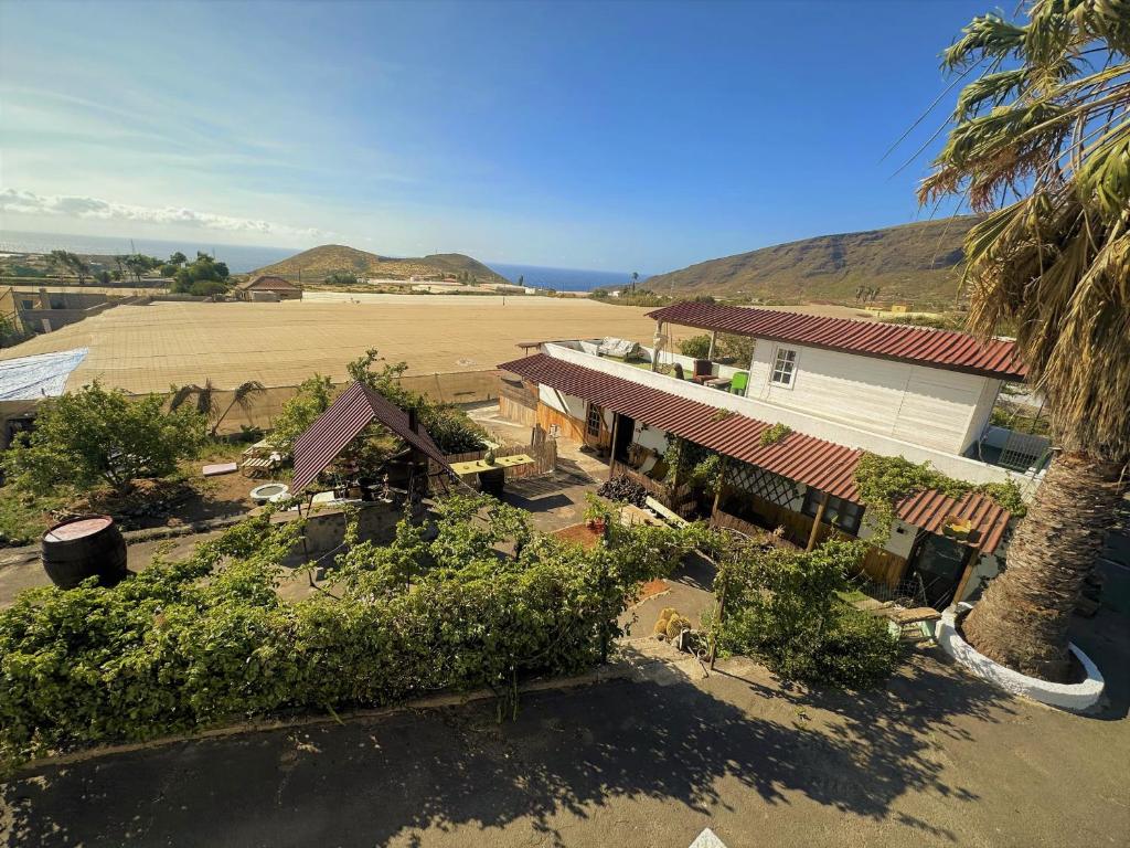 an aerial view of a house and a field at Los Conejos in Santa Cruz de Tenerife