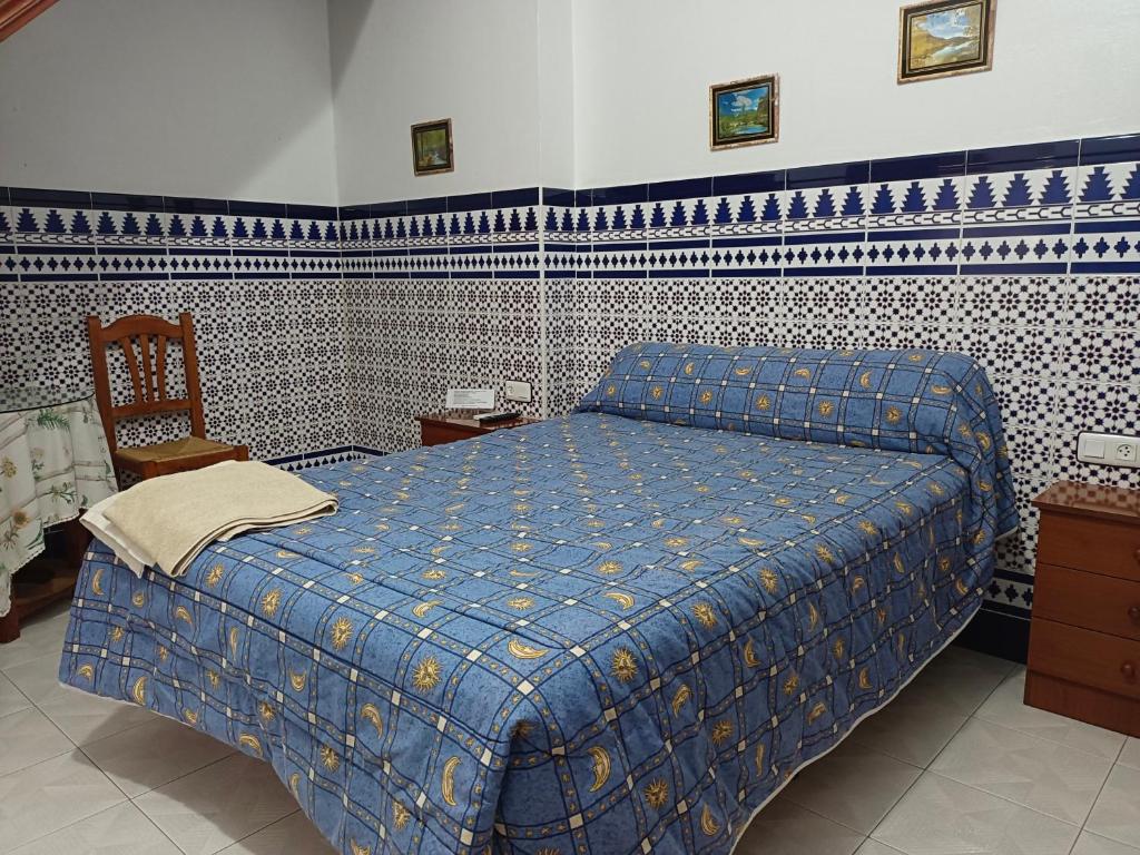 Ένα ή περισσότερα κρεβάτια σε δωμάτιο στο PENSIÓN LARRA