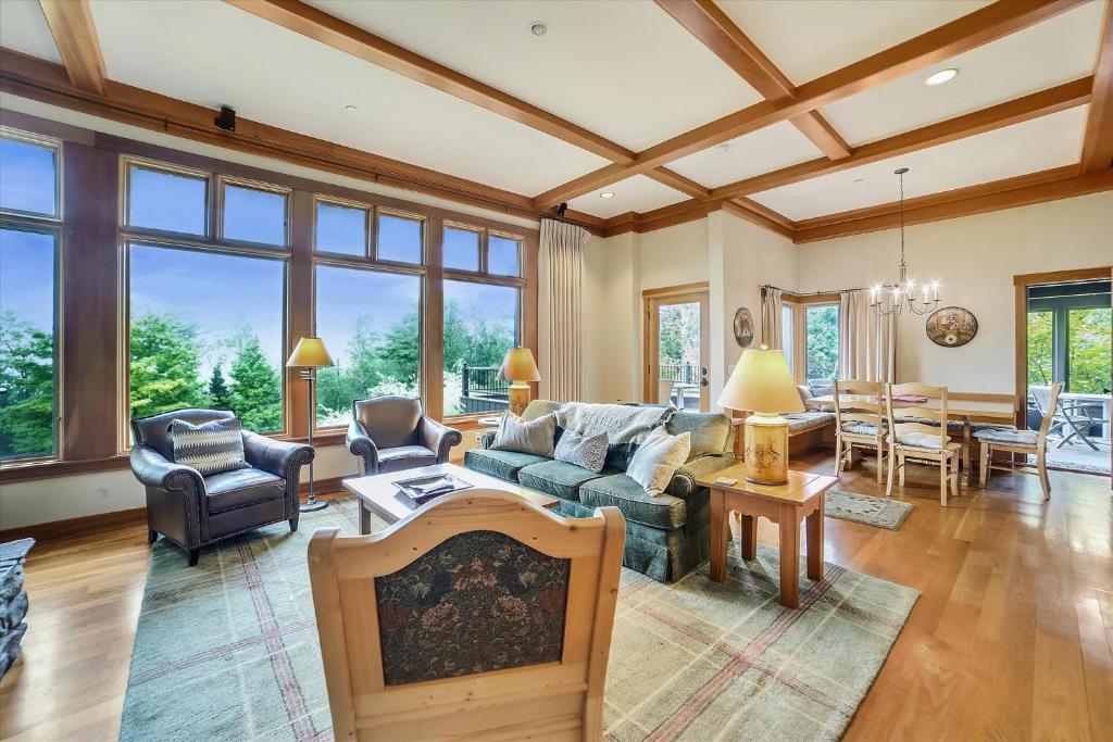 a living room with a couch and a table at Trapp Villa 29 in Stowe