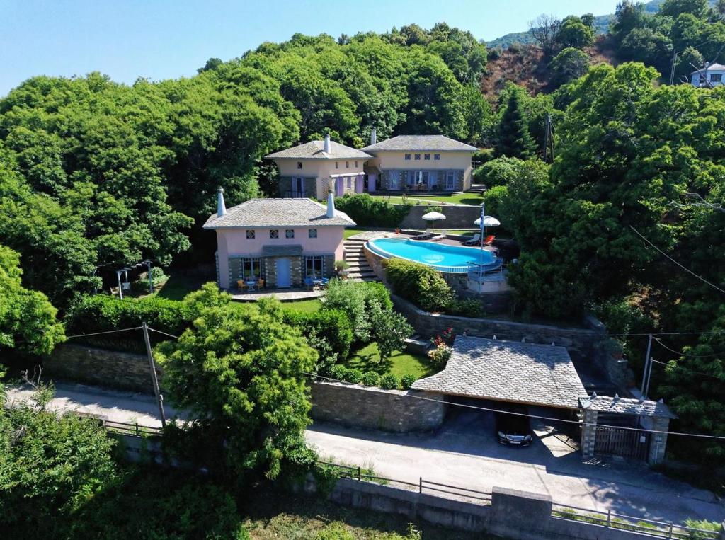 an aerial view of a house with a swimming pool at Tsagkarada Country Estate with Pool in Tsagarada