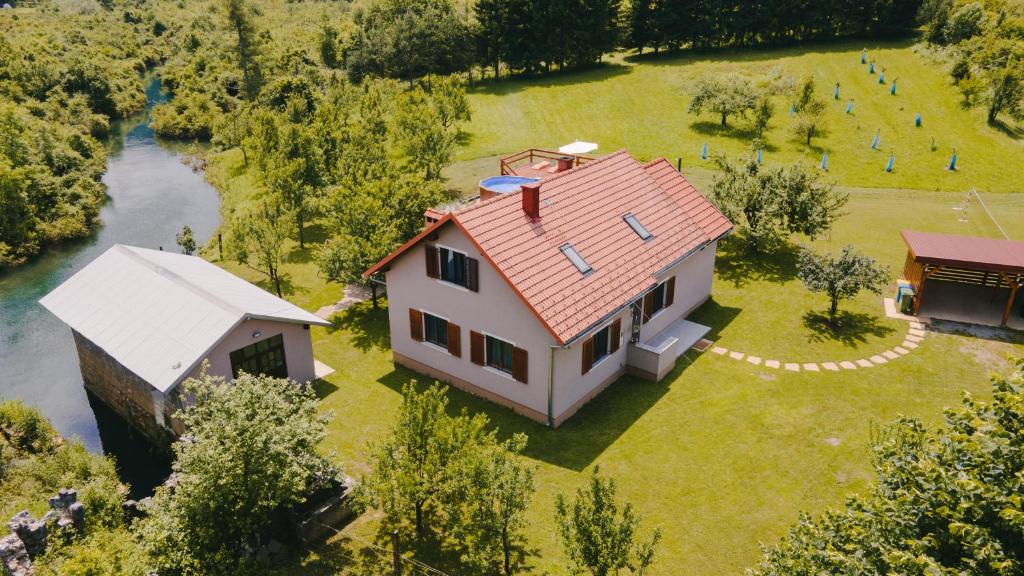 an aerial view of a house and a river at Holiday house Daisy in Plaški