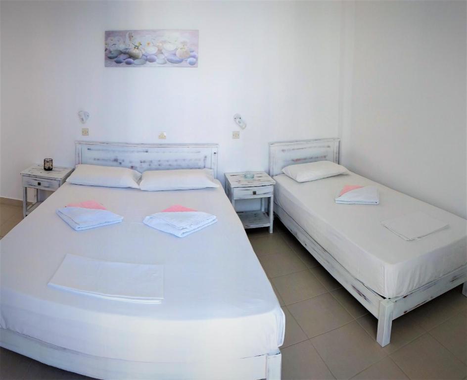 Postel nebo postele na pokoji v ubytování Dolphin Rooms