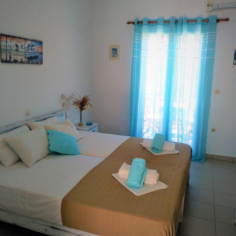 Postel nebo postele na pokoji v ubytování Dolphin Rooms