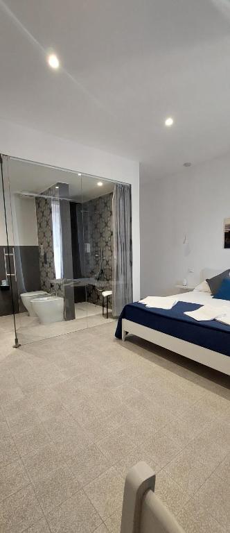 Postel nebo postele na pokoji v ubytování Miramare rooms b&b
