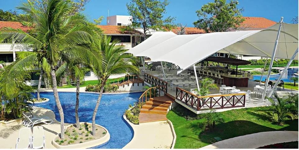 an aerial view of a resort with a swimming pool at Private Owned Suite at Coronado Luxury Suite Hotel & Golf Course in Playa Coronado