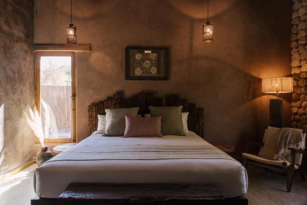 Postel nebo postele na pokoji v ubytování Our Habitas Atacama