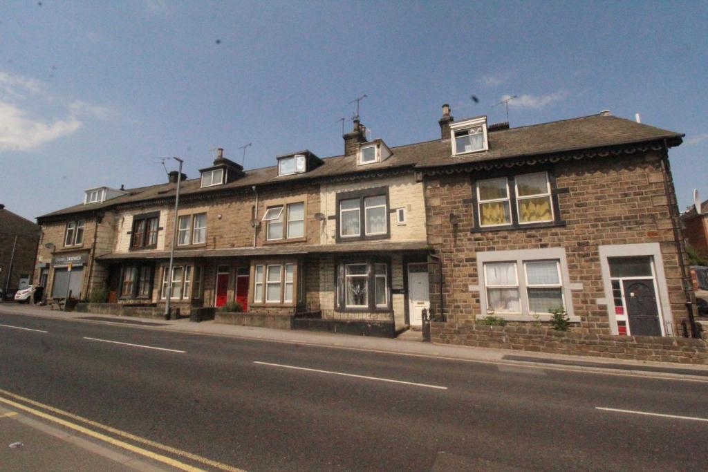 a brick building on the side of a street at Lundwood House Barnsley by Smart Corporate Stays in Barnsley