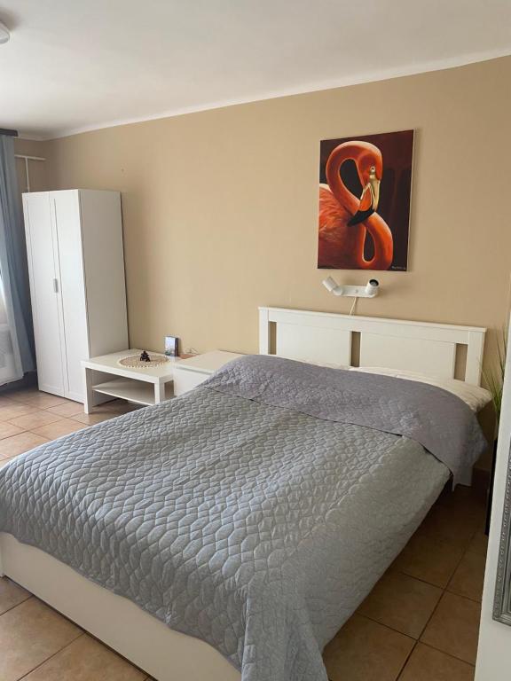 Postel nebo postele na pokoji v ubytování SunSet Beach Apartman