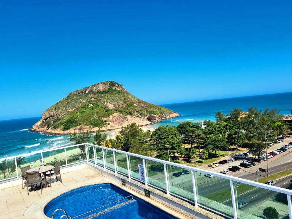 a view from the balcony of a condo with a view of the ocean at Atlantico Sul Hotel in Rio de Janeiro