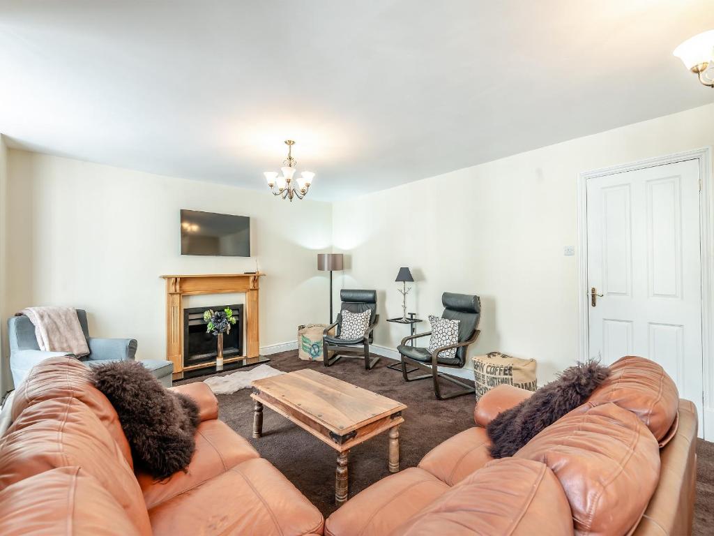 a living room with a couch and a table at The Coffee House in Coleford