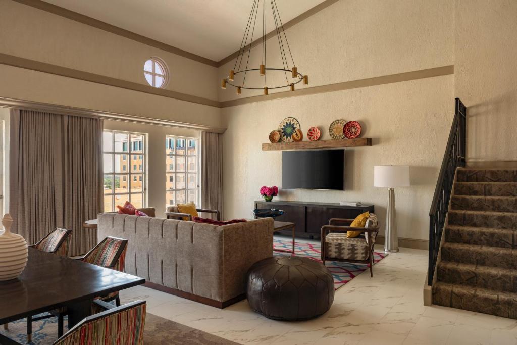 a living room with a couch and a table at Hyatt Regency Coral Gables in Miami in Miami