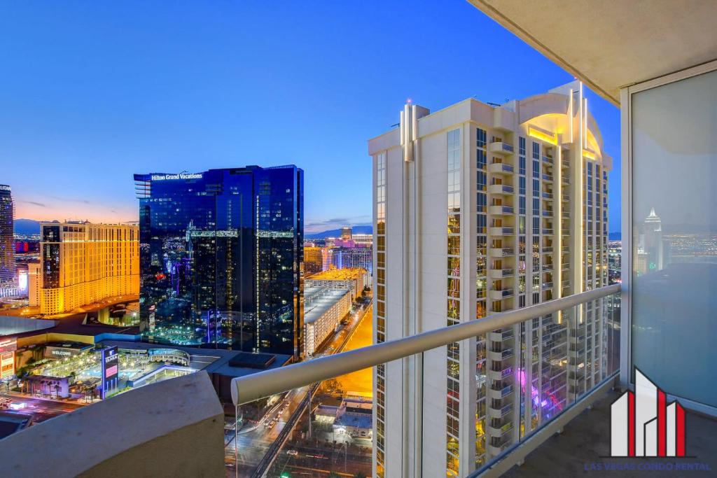 a view of a city at night from a balcony at MGM Signature-33-705 F1 Track & Strip View Balcony in Las Vegas