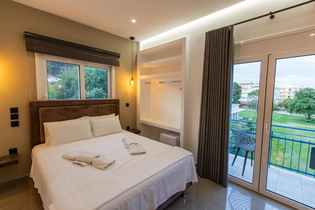 Ένα ή περισσότερα κρεβάτια σε δωμάτιο στο Pansion Aphodite