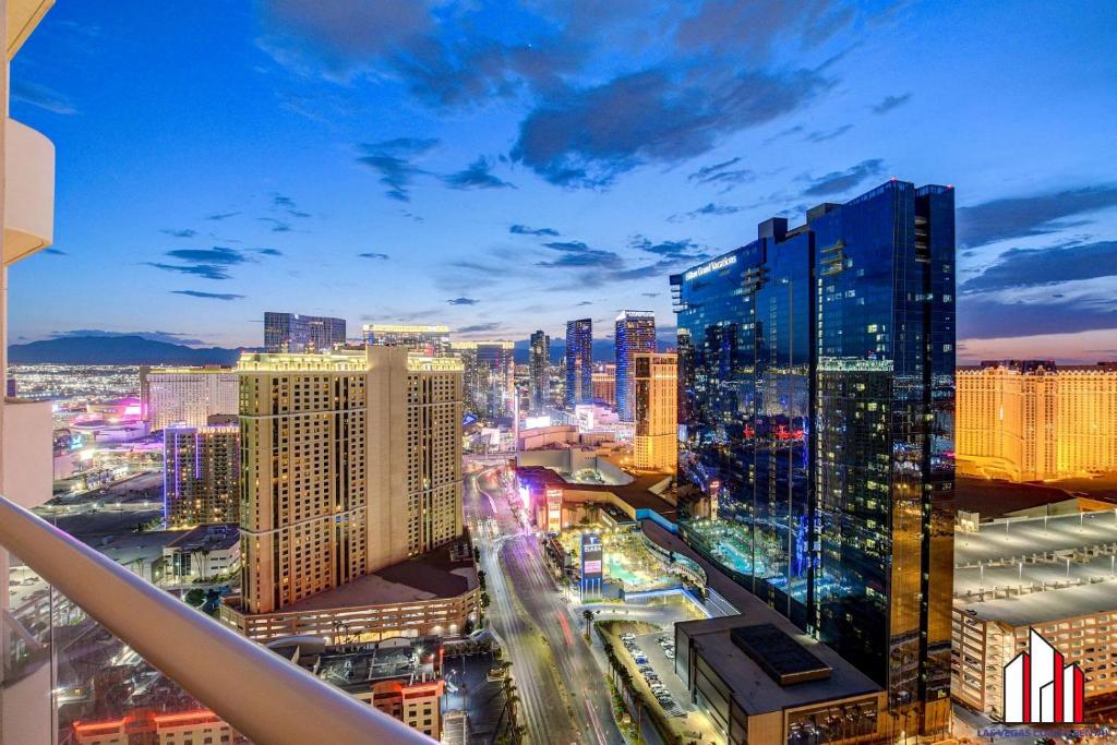 a view of a city skyline at night at MGM Signature-34-821 1Br2Ba F1 Strip View Balcony in Las Vegas