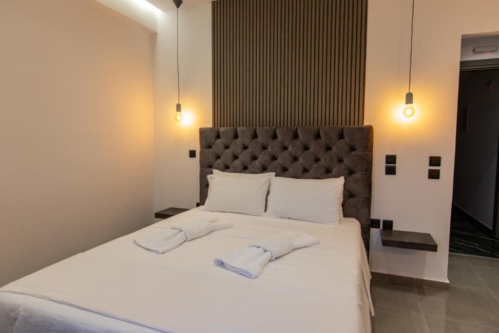 Ένα ή περισσότερα κρεβάτια σε δωμάτιο στο Pansion Aphodite