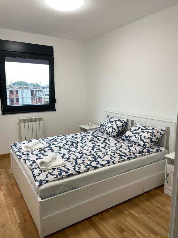 Postel nebo postele na pokoji v ubytování Apartman Luni