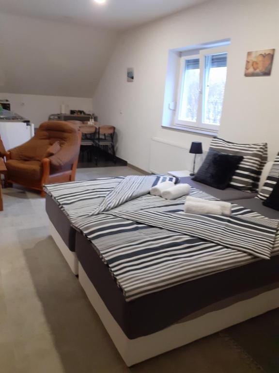Postel nebo postele na pokoji v ubytování Apartmani Marijamagdalena