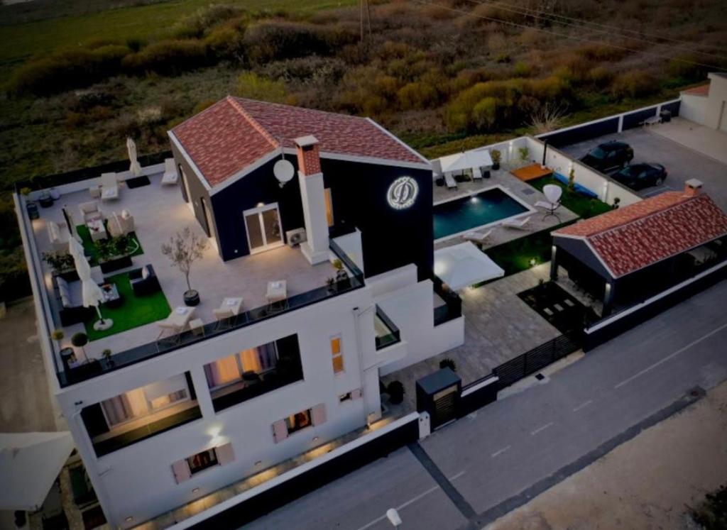 an aerial view of a house with a pool at D-Palace-Adriatic in Zemuniki