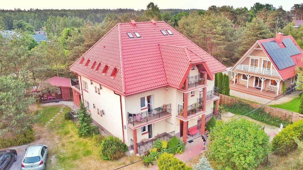 an overhead view of a house with a red roof at Willa Mazowiecka Jantar in Jantar