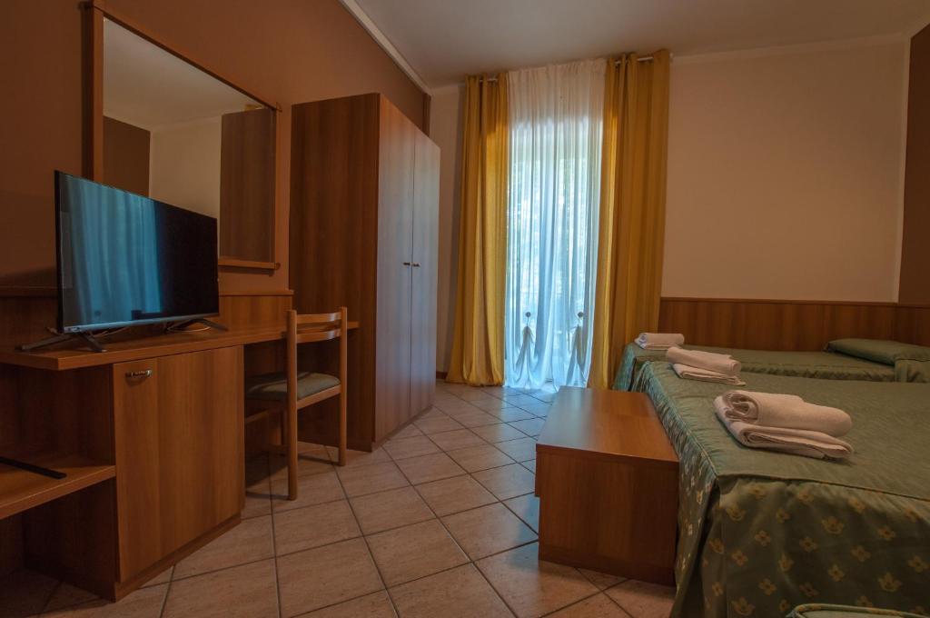 TV a/nebo společenská místnost v ubytování Hotel Orsini