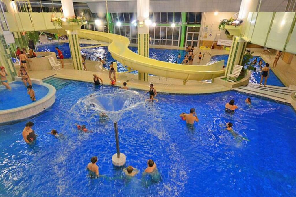 a group of people in an indoor swimming pool at Orcières Merlette appartement T2 à 50m des pistes-4 personnes-Chalet d’Orcières- été et hiver in Orcières