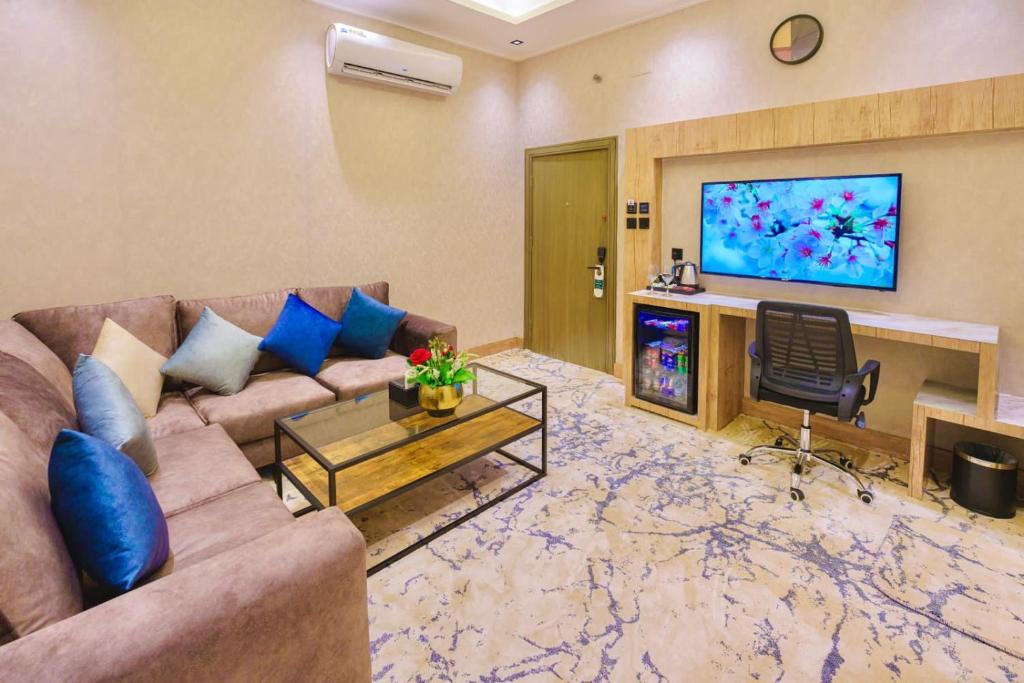 TV a/nebo společenská místnost v ubytování Wissam Al-Hawra Hotel