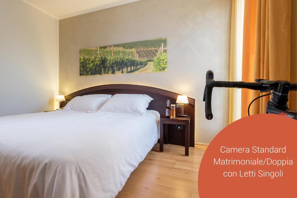 Postel nebo postele na pokoji v ubytování Wine Hotel San Giacomo Activity & Wellness