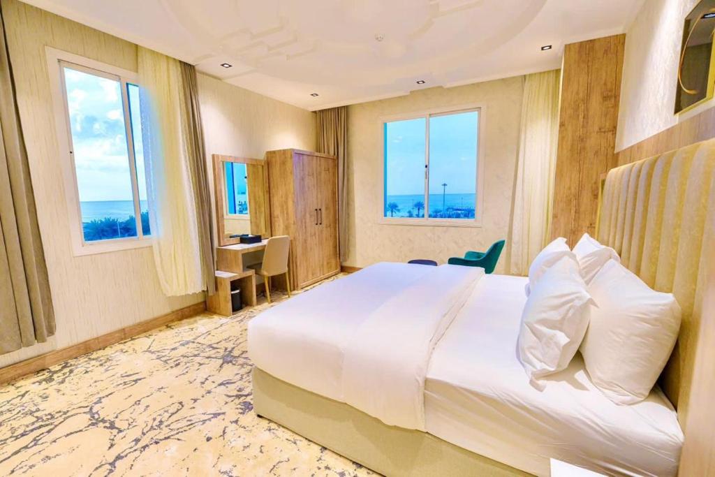 Postel nebo postele na pokoji v ubytování Wissam Al-Hawra Hotel