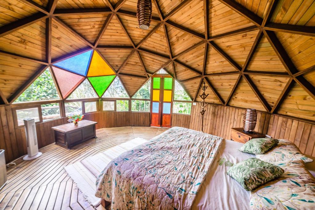 Postel nebo postele na pokoji v ubytování Tambo Eco Hotel