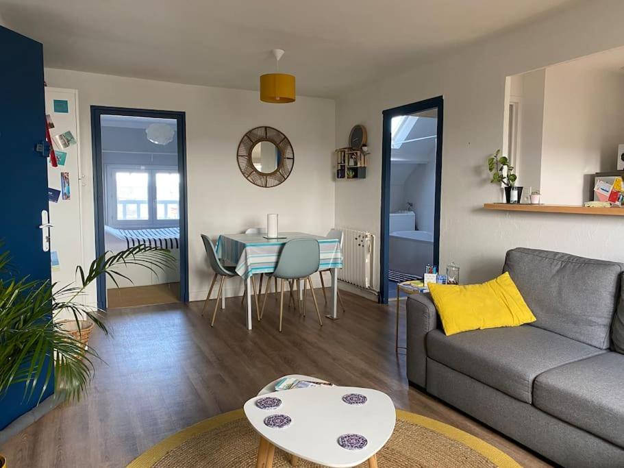 a living room with a couch and a table at Appartement 4 personnes Centre Dinard in Dinard
