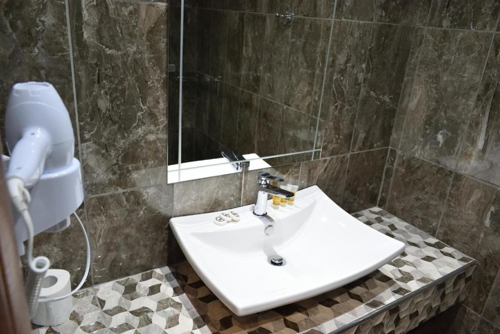 Koupelna v ubytování Dioscuri Deluxe Apartments