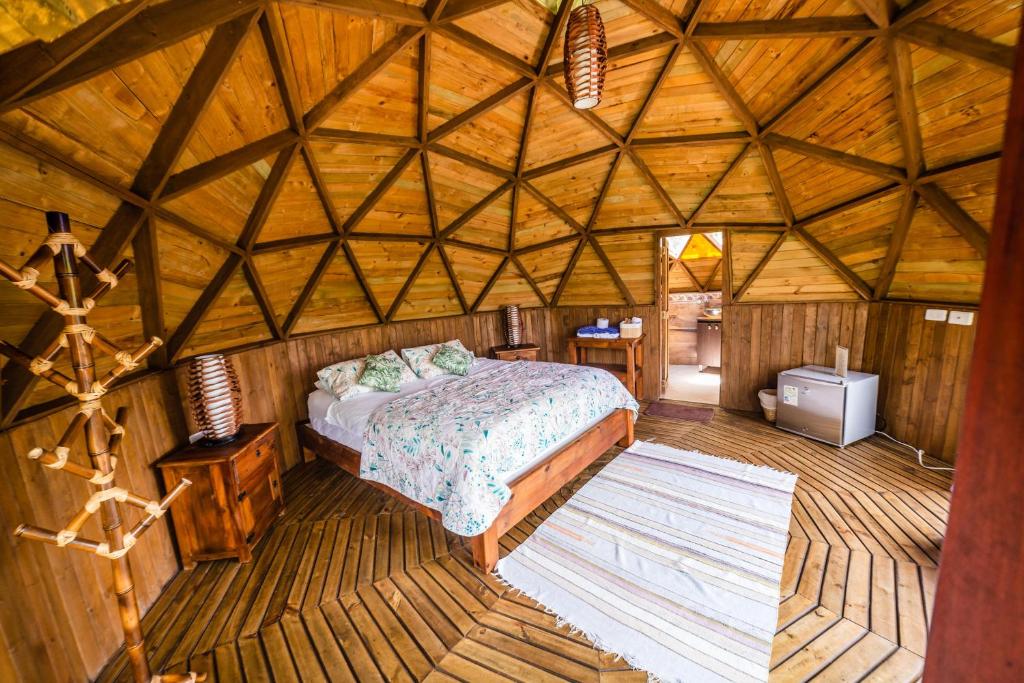 Postel nebo postele na pokoji v ubytování Tambo Eco Hotel
