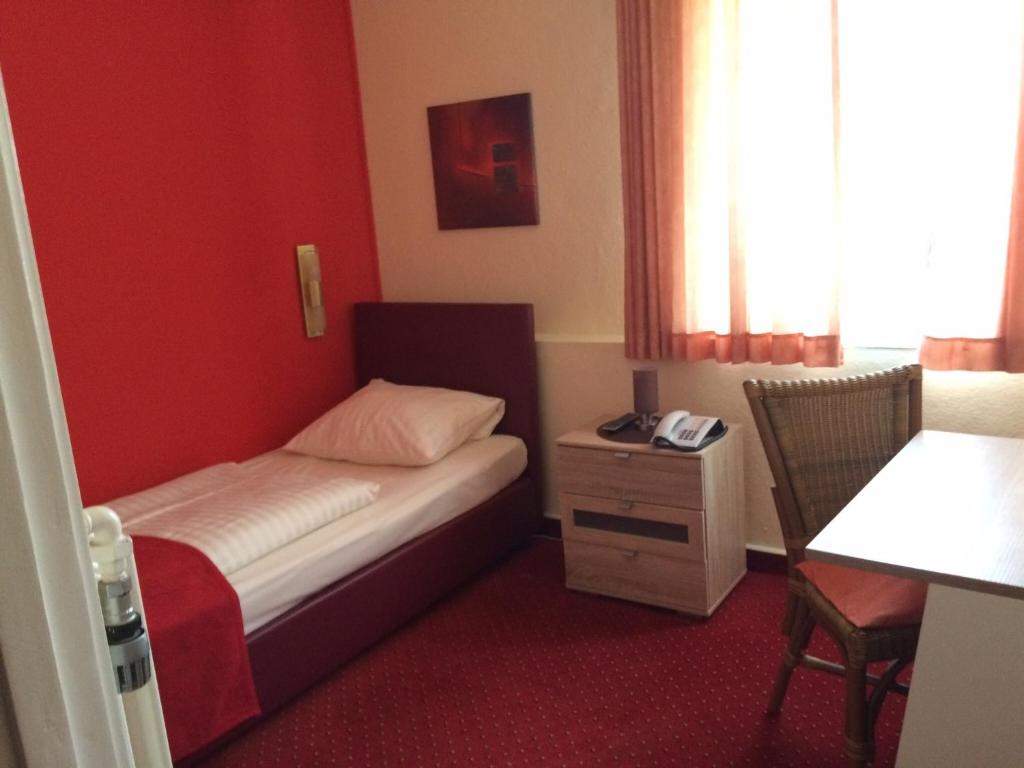 Ein Bett oder Betten in einem Zimmer der Unterkunft Hotel Imperial