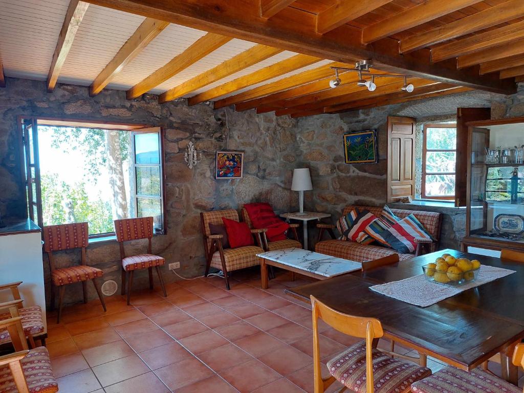 Posedenie v ubytovaní A Casiña Casitas con jardin de ensueño
