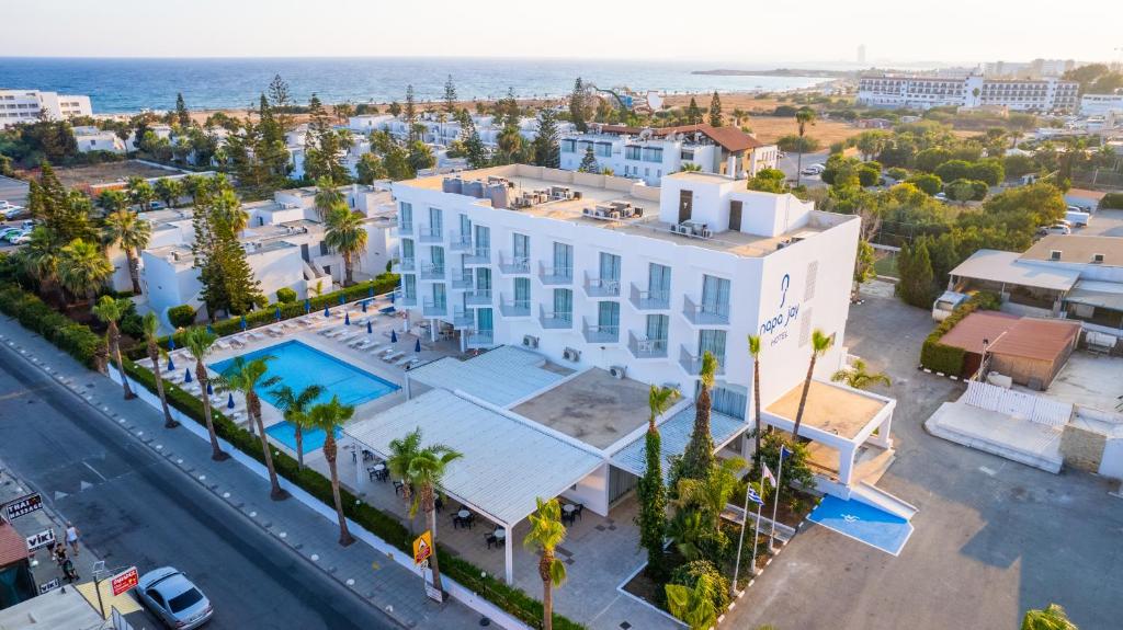 an aerial view of a building and the ocean at Napa Jay Hotel in Ayia Napa