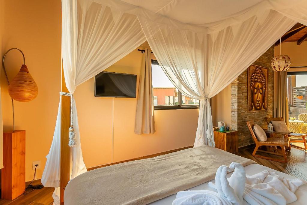 Cama ou camas em um quarto em Shiva Boutique Hotel - Praia do Rosa