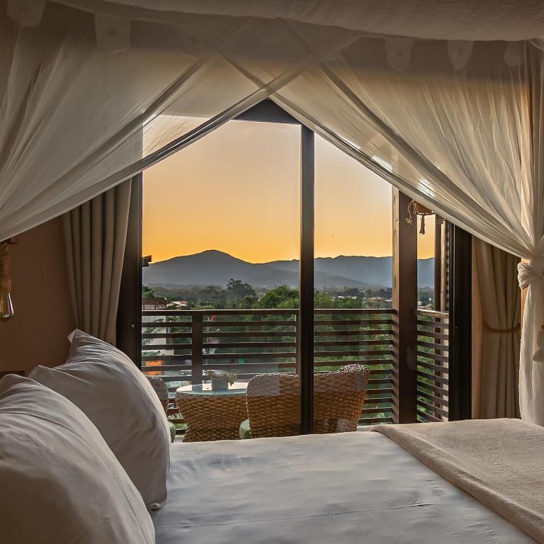 Cama ou camas em um quarto em Shiva Boutique Hotel - Praia do Rosa