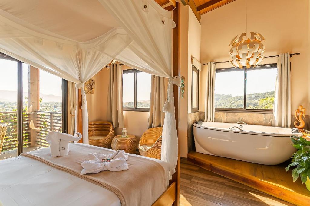 Cama ou camas em um quarto em Shiva Boutique Hotel - Praia do Rosa