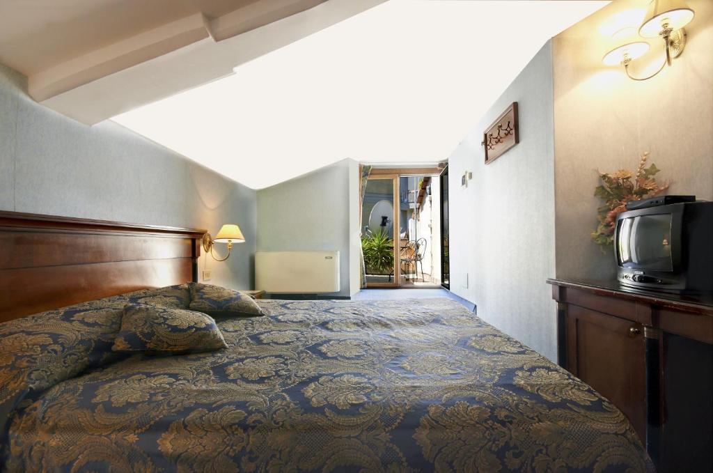 Postel nebo postele na pokoji v ubytování Hotel Silva
