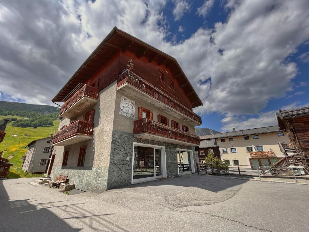 a building with balconies on the side of it at Casa Della Lepre in Livigno