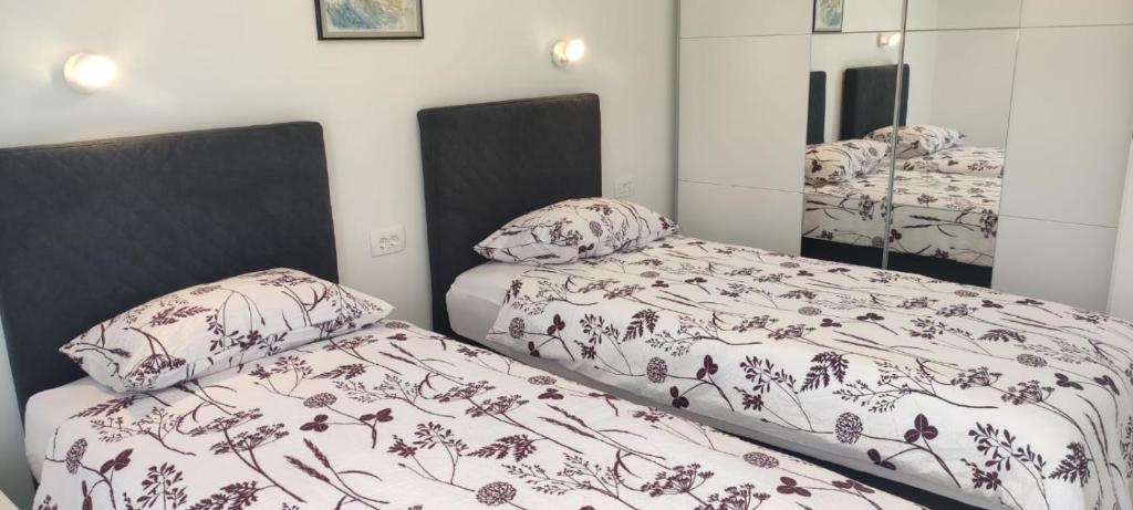 Voodi või voodid majutusasutuse Apartments INBOX toas