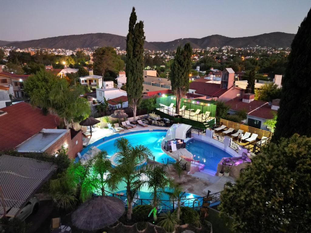 an overhead view of a swimming pool in a resort at Complejo Los Cipreses in Villa Carlos Paz